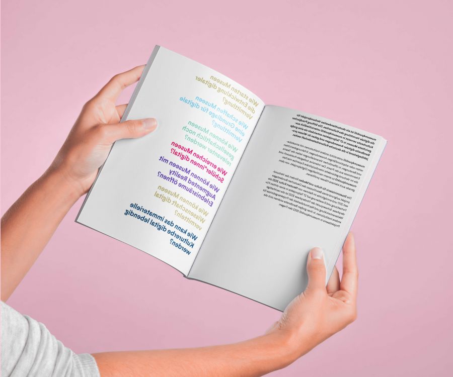museum4punkt0 2holding hand open magazine catalog mockup 1 flip